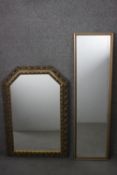 Two contemporary gilt moulded frame wall mirrors. One with a pierced foliate design frame and the