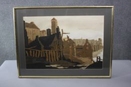 A framed and glazed fabric applique collage of a seaside town. Signed Yolanda. H.61 W.81cm.