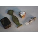 A collection of boxes and other items. Including a mid century brass double sided paperweight of a