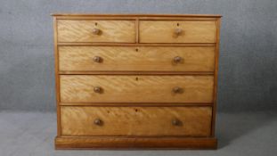 A Victorian birch chest of drawers with inset leather top on plinth base. H.87 W.120 D.45CM