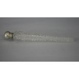 A Victorian 'lay down' cut glass perfume flask with silver top. Hallmarked: GB for George Byworth,