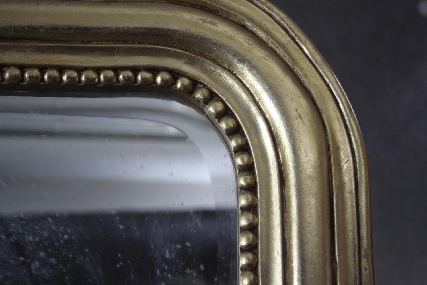 A full height gilt framed pier mirror with arched plate in moulded and beaded frame with shell - Image 4 of 4