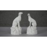 Two 19th century Parianware style dogs on rock formation bases. One of a Greyhound and one of a