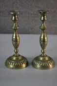 A pair of Victorian brass candlesticks with gadrooned detailing. H.30 Diameter 13cm.