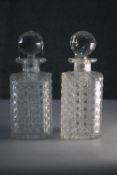 A pair of Victorian hand cut crystal decanters with faceted globe stoppers. H.24 W.10 D.10cm.