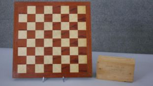 A Staunton style carved boxwood chess set and board. (complete) L.41 W.41CM