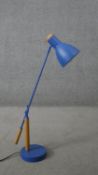 A Made.com blue anglepoise style desk lamp with beech detailing. H.66 W.67CM (extended)