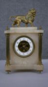 A 19th century alabaster and gilt spelter mantle clock. Lion to the top and exposed skeleton