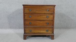A 19th century mahogany Georgian style small chest of four drawers on shaped bracket feet. H.70 W.62