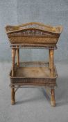 A vintage wicker tray top occasional table on splay woven supports united by under tier. H.63 W.40