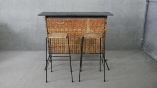 A vintage Waikiki style home bar and two matching bar stools. H.104 W.122 D.36CM (Bar)