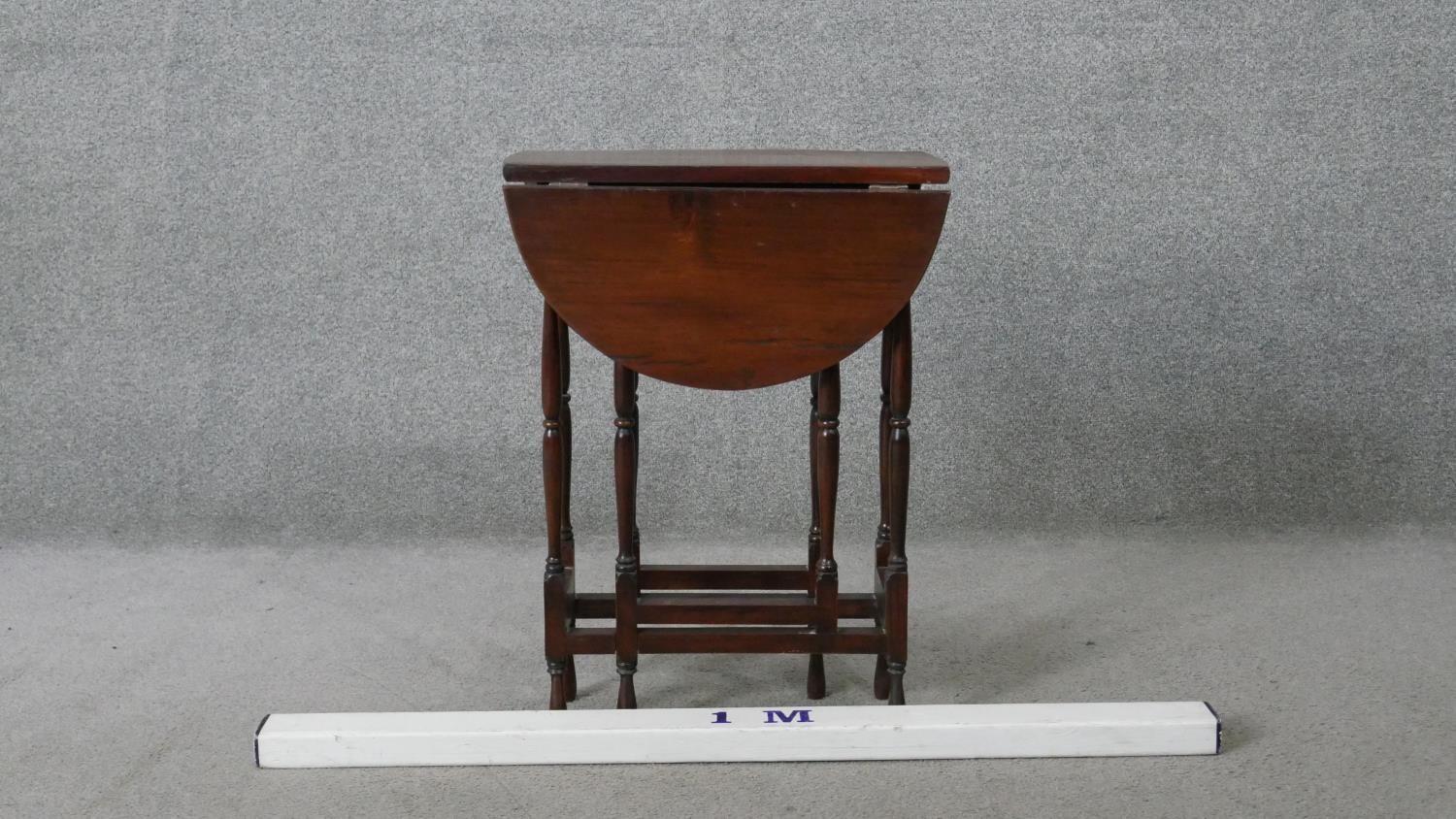 A vintage teak drop flap table on turned stretchered gateleg supports. H.62 W.60 D.45CM - Image 2 of 5