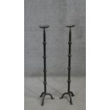 A pair of Gothic style cast iron tripod leg floor standing pricket candlesticks. H.91 W.21 cm