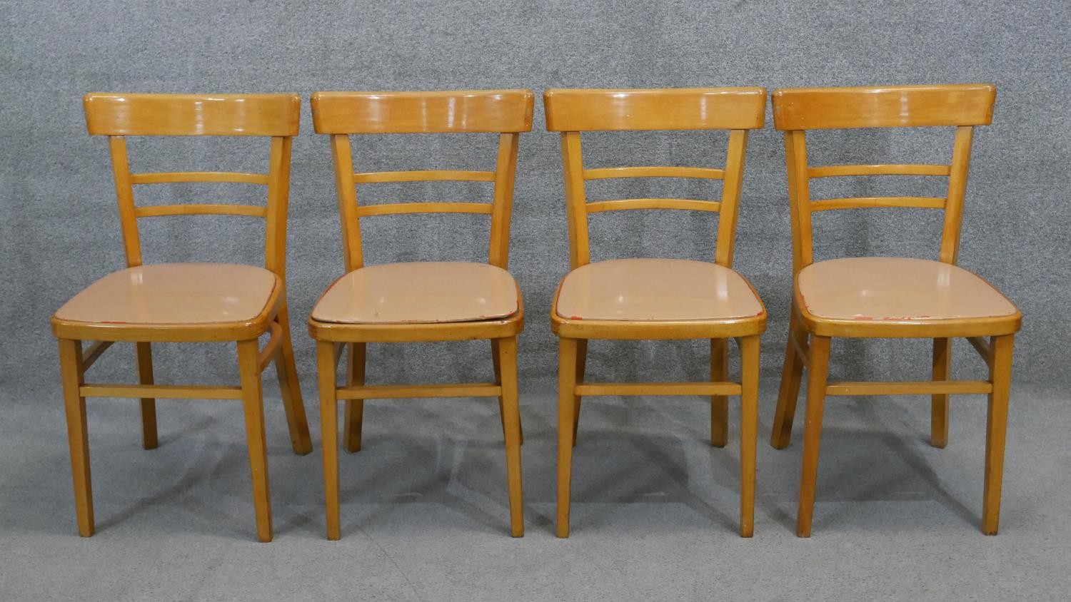 A set of four vintage beech kitchen chairs.