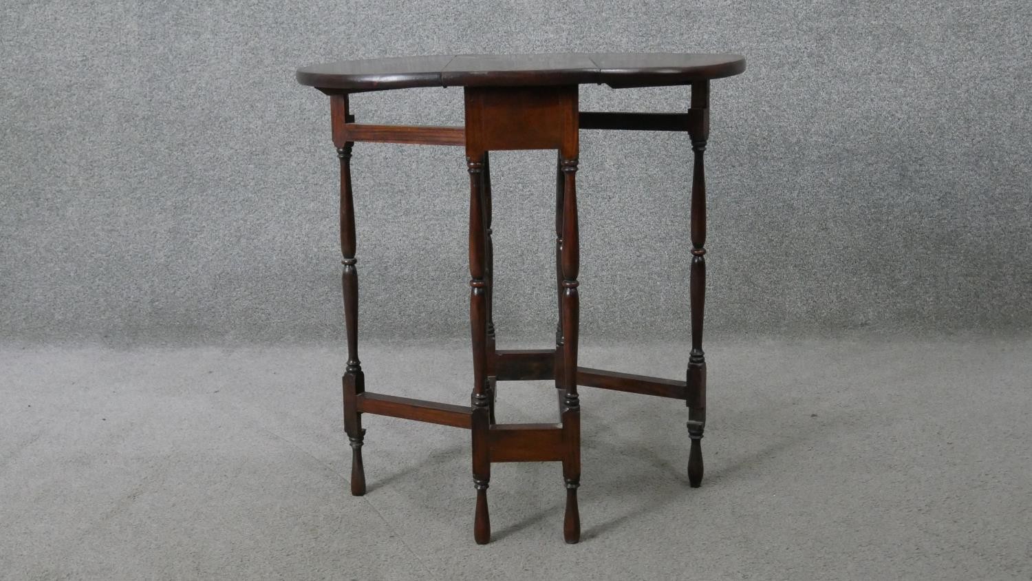 A vintage teak drop flap table on turned stretchered gateleg supports. H.62 W.60 D.45CM - Image 4 of 5