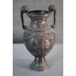 A large Victorian white metal repousse decoration twin handled commemorative cup. One side decorated