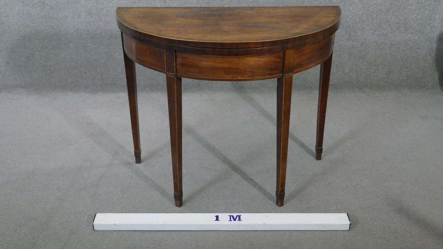 A Georgian mahogany demi lune fold over top card table with satinwood line inlay and gateleg - Image 2 of 4