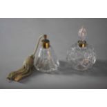 A cut glass perfume bottle with blown glass stopper along with a cut glass atomiser. H.17