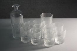 A set of eleven Baccarat Nancy hand cut crystal whisky tumblers with abstract square design. Along