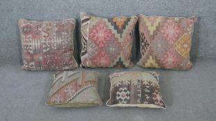 Five 20th century Persian Kelim covered cushions. H.47 W.47cm (largest)