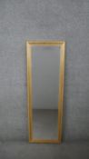 A contemporary bevelled plate wall mirror in gilt frame. H.125 W.41CM