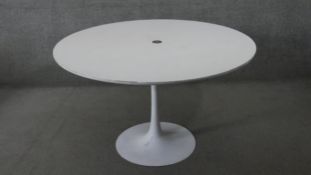 A vintage Eero Saarinen style 'Tulip' dining table with composite laminated top on aluminium base.