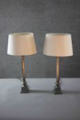 A pair of vintage brass fluted column design table lamps with cream shades. H.54 W.20 D.12cm.