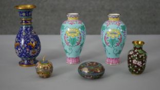 A collection of Chinese enamel pieces. Including a pair of Canton enamel vases decorated with