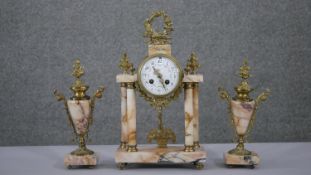 A late 19th Century French pink marble clock garniture, Arabic numerals to white enamel circular