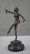 After Chiparus- an Art Deco style bronze figure of a dancing jester. Mounted on black marble base.