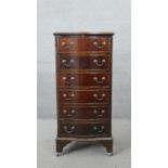 A Georgian style mahogany serpentine fronted tall chest of six drawers on shaped bracket feet. H.100