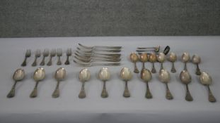 A collection of Victorian silver cutlery. Including ten large serving spoons, seven dessert