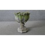 A cast concrete stylised foliate design pedestal planter. H.55 W.49 D.49cm