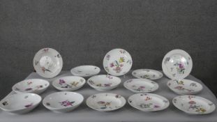 Fifteen 18th century Meissen (Punkt) plates and bowls with hand painted floral decoration. Makers