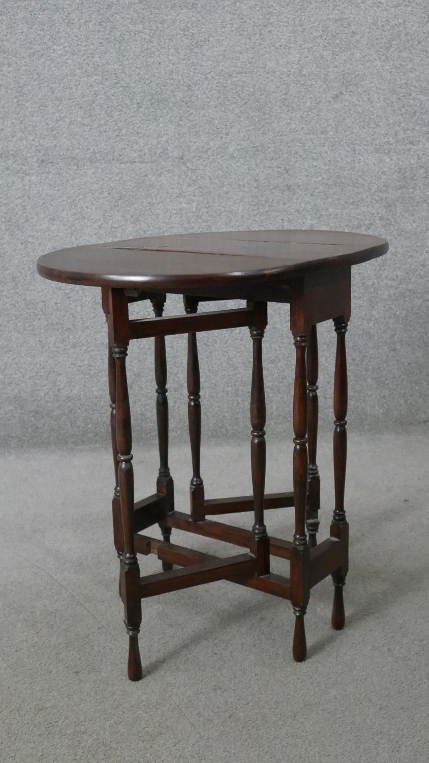 A vintage teak drop flap table on turned stretchered gateleg supports. H.62 W.60 D.45CM - Image 5 of 5