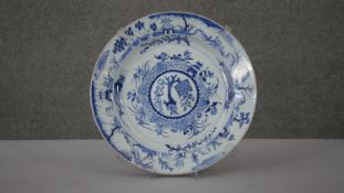 A large Kangxi blue and white hand painted porcelain charger. Decorated with temples and pagodas
