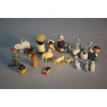 A collection of eighteen miniature items. Including A Kobe charm with retractable eyes, a lead