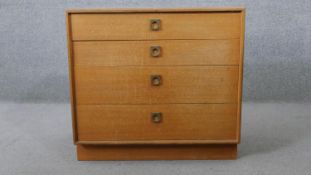 A vintage teak G-Plan chest of four long drawers on plinth base. H.71 W.76 D.44CM