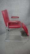 A mid century metal framed articulated physiotherapy chair in faux leather upholstery. H.138 W.72