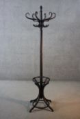 A bentwood coat and umbrella stand. H.187 W.60 cm.