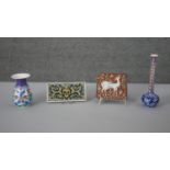 An collection of Turkish ceramics. Including two tiles one with a deer design and two floral
