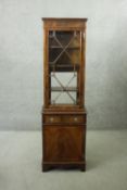 A Georgian style mahogany and satinwood strung narrow library bookcase. H.180 W.53 D.33 cm.
