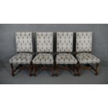 A set of four Continental antique style dining chairs in studded and cut floral upholstery on walnut