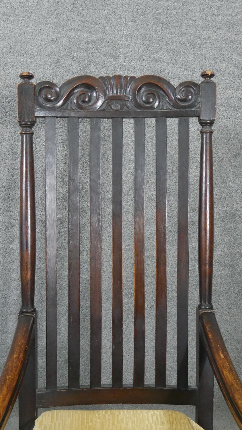 A 19th century oak Carolean style armchair with scroll cresting to the back rail and raised on - Image 3 of 5