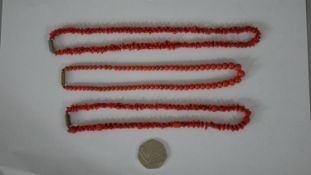 Three 19th century coral necklaces. One comprised of sevety five graduated round beads with a yellow