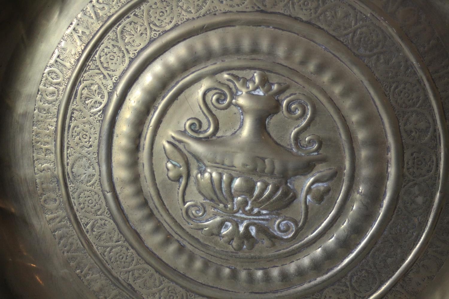 A large 19th century repousse brass charger with urn design to the centre and lettering to the edge. - Image 3 of 4