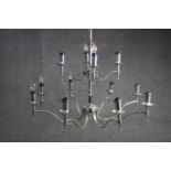 A contemporary twelve branch chrome chandelier. H.70 Diameter. 95cm.