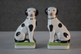 A pair of vintage Staffordshire style black and white ceramic hand painted spaniels. H.20 W.10 D.