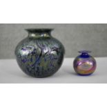 Two iridescent studio art glass vases. One in the Lutz style with oil slick swirl glass. Unsigned.