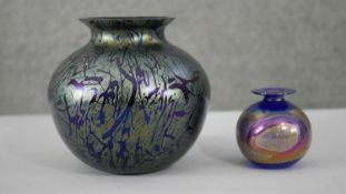 Two iridescent studio art glass vases. One in the Lutz style with oil slick swirl glass. Unsigned.